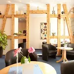 호텔 Komfort Am Kurpark 4*